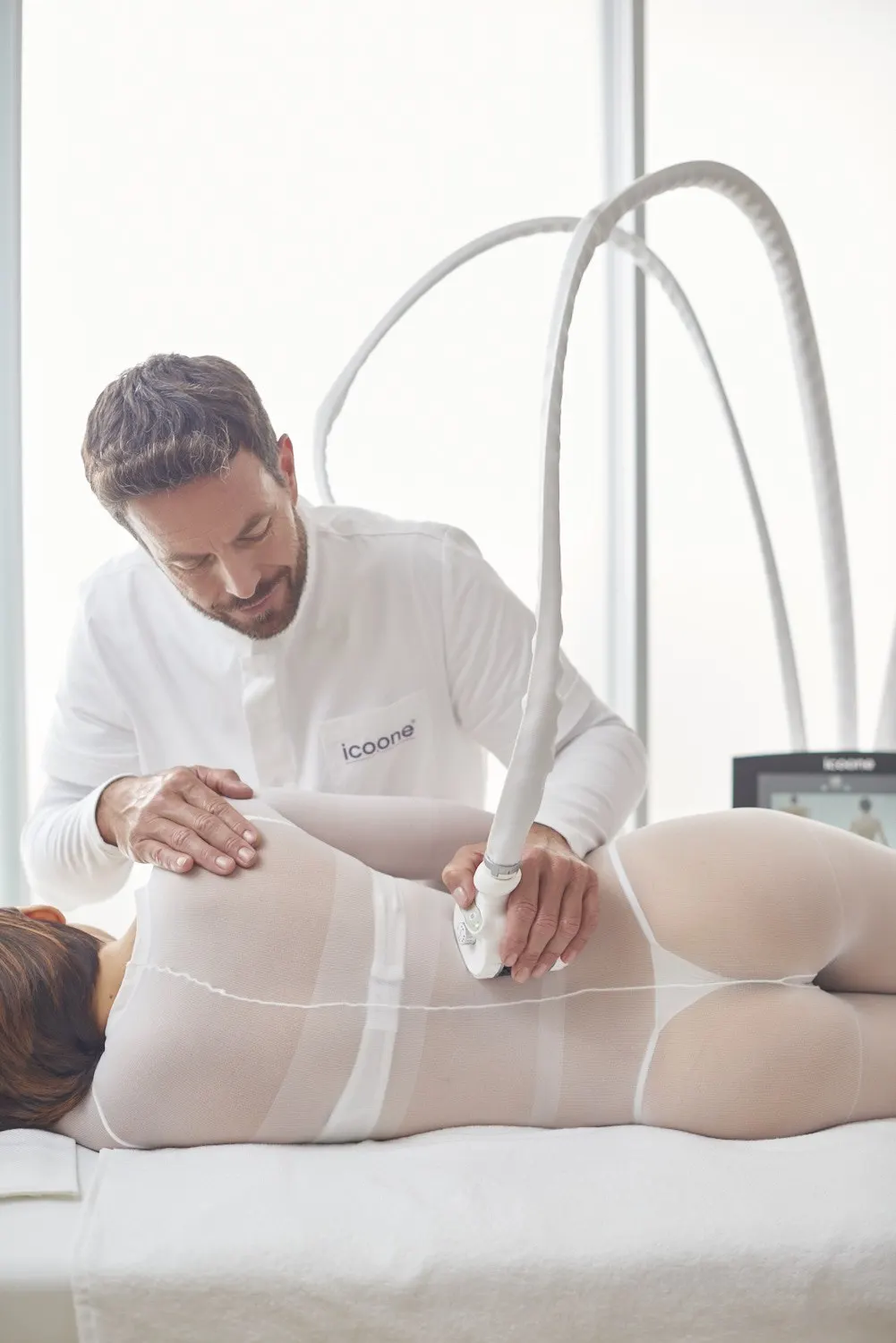 icoone® body session with the client body suit, the hygiene layer for body work